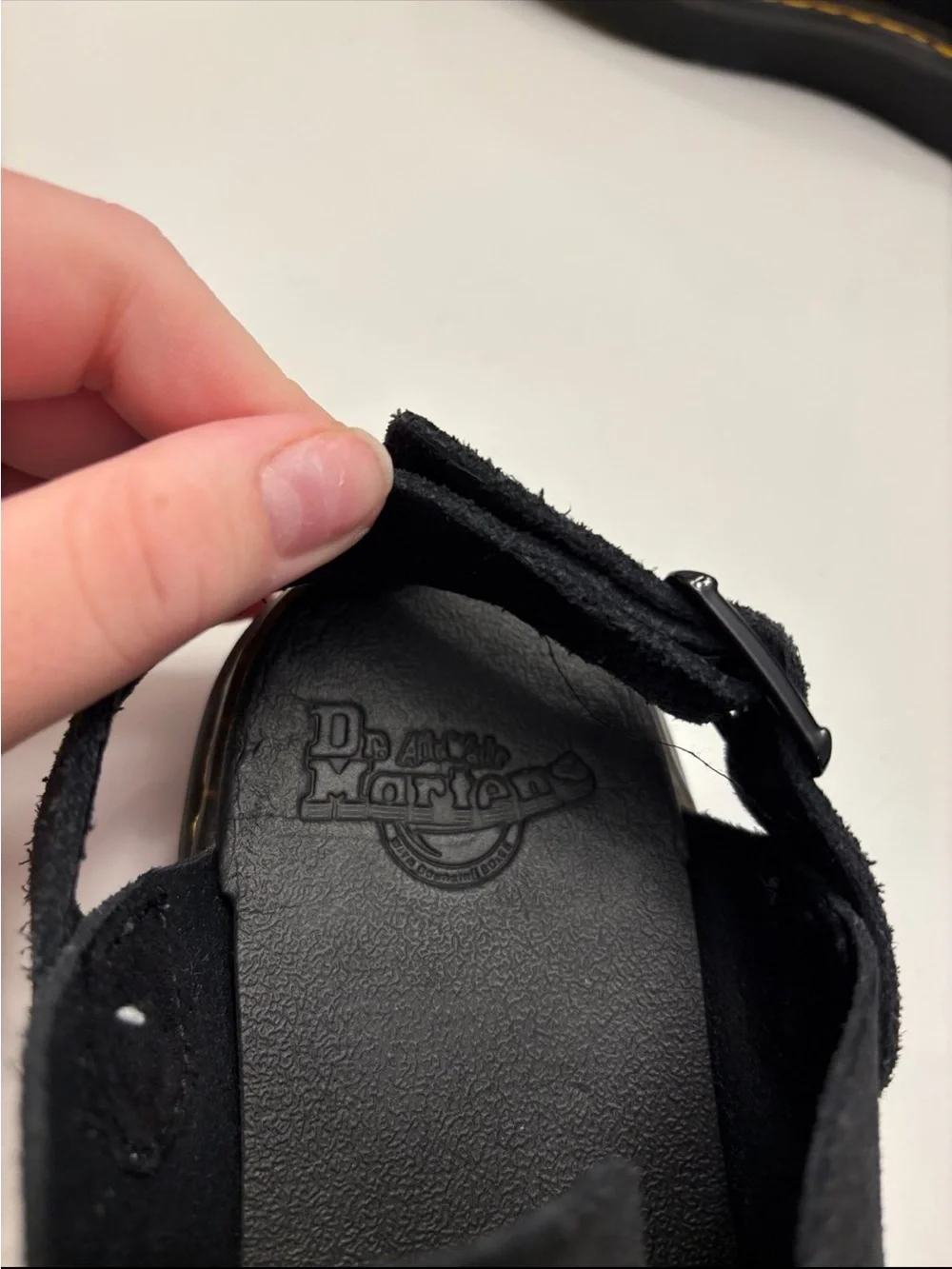 Dr. Martens Carlson slingback mules in black suede, with a chunky buckle